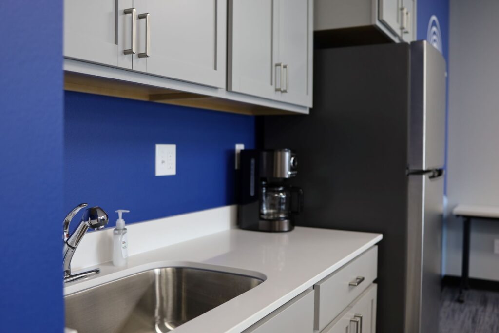 Modern kitchen with blue accent wall