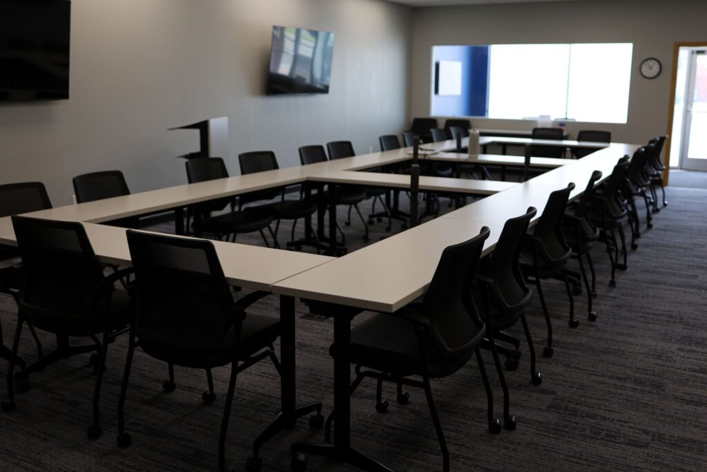 Empty conference room with tables and chairs