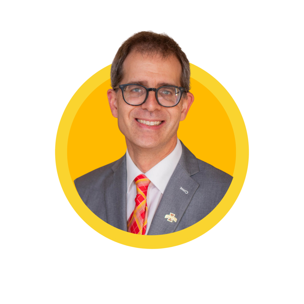 Smiling man in suit and glasses