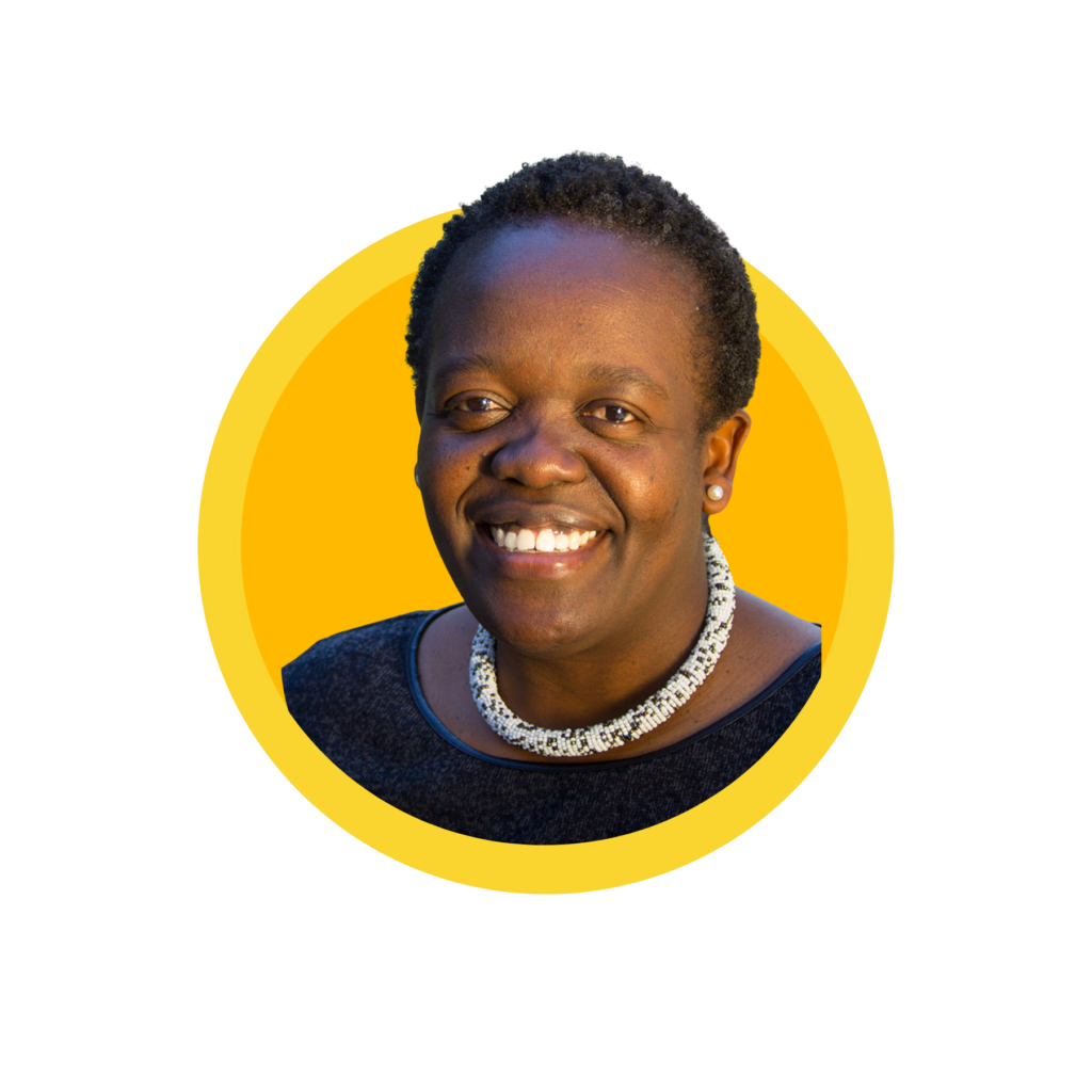 Smiling woman with necklace, yellow background