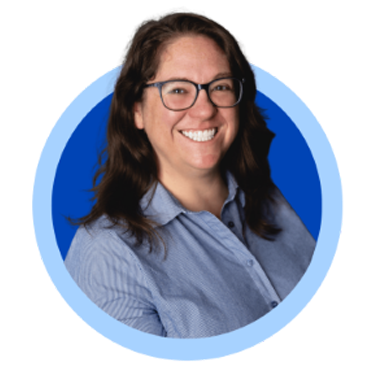 Smiling woman with glasses, blue background