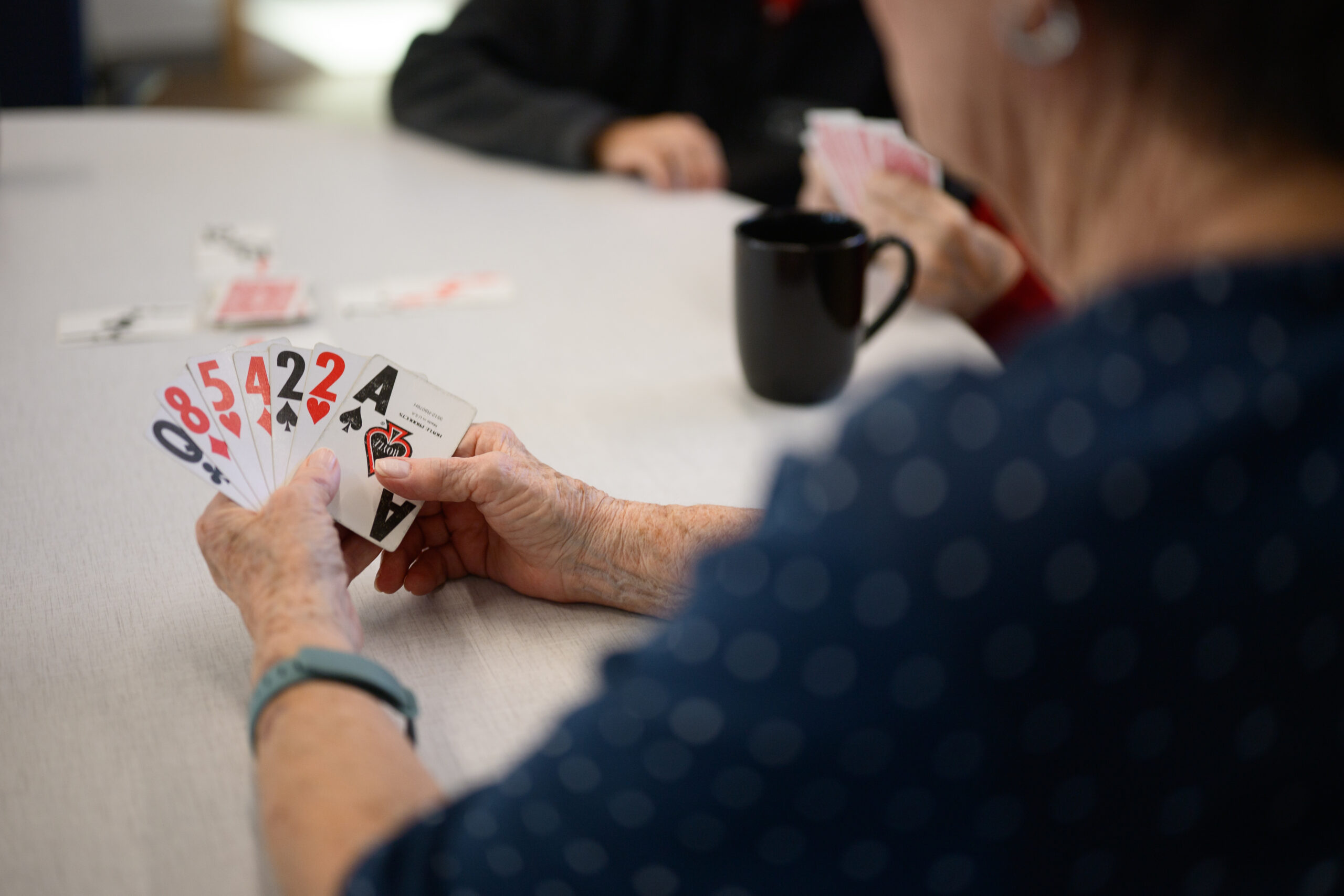 Playing cards at a table