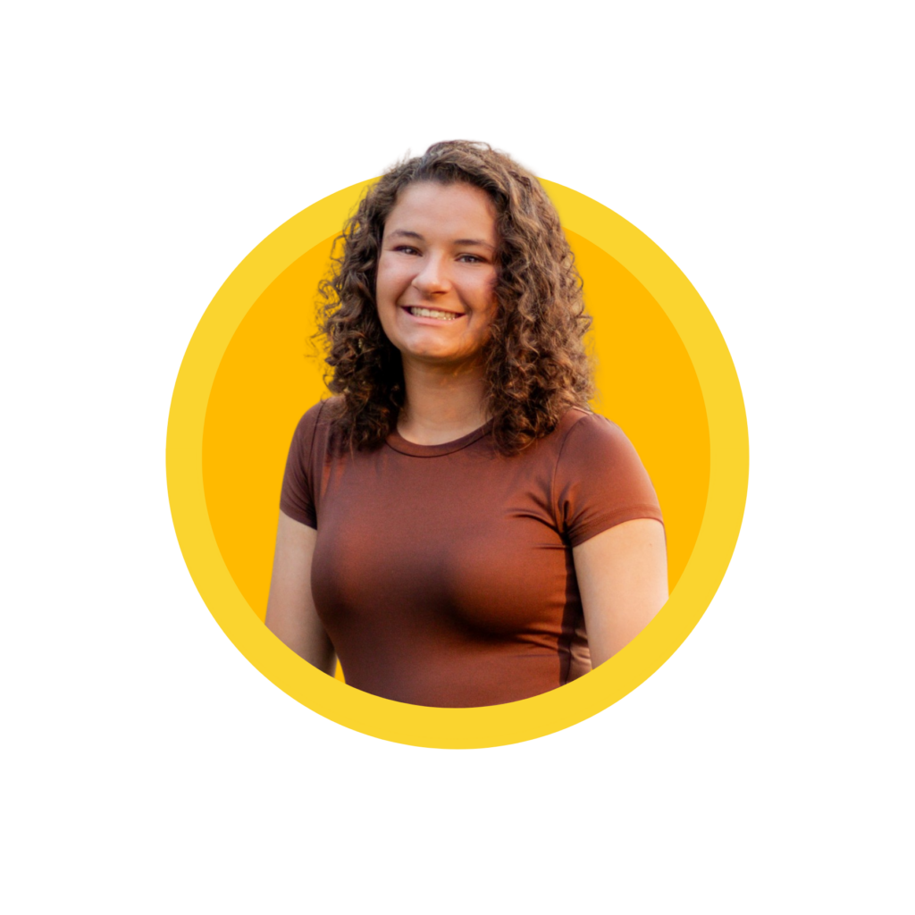 Smiling person with curly hair