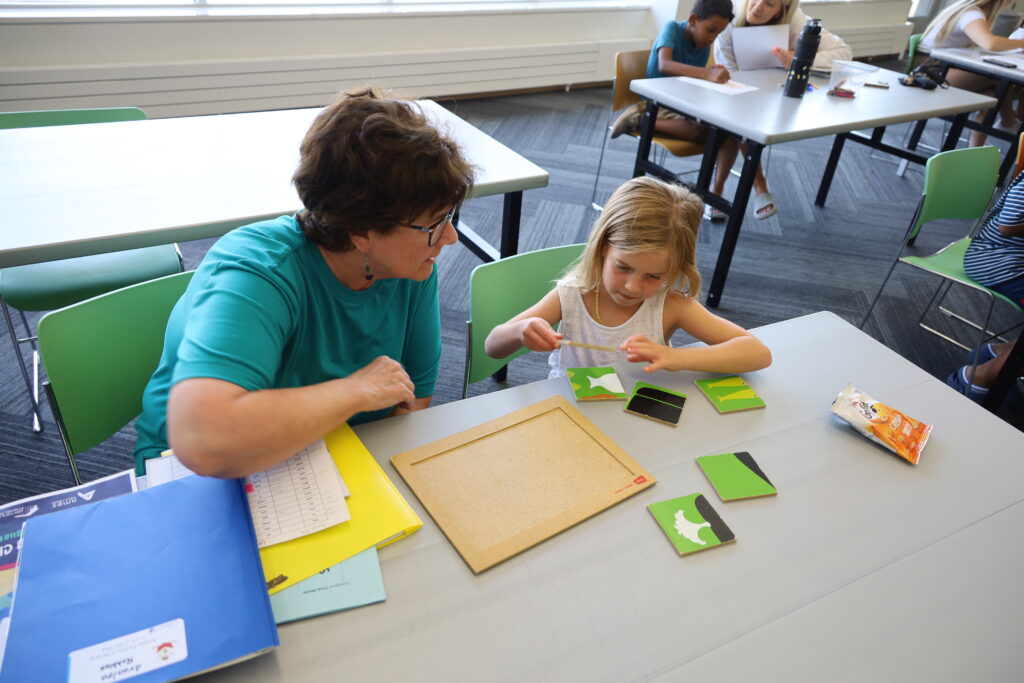 Adult and child working on puzzle