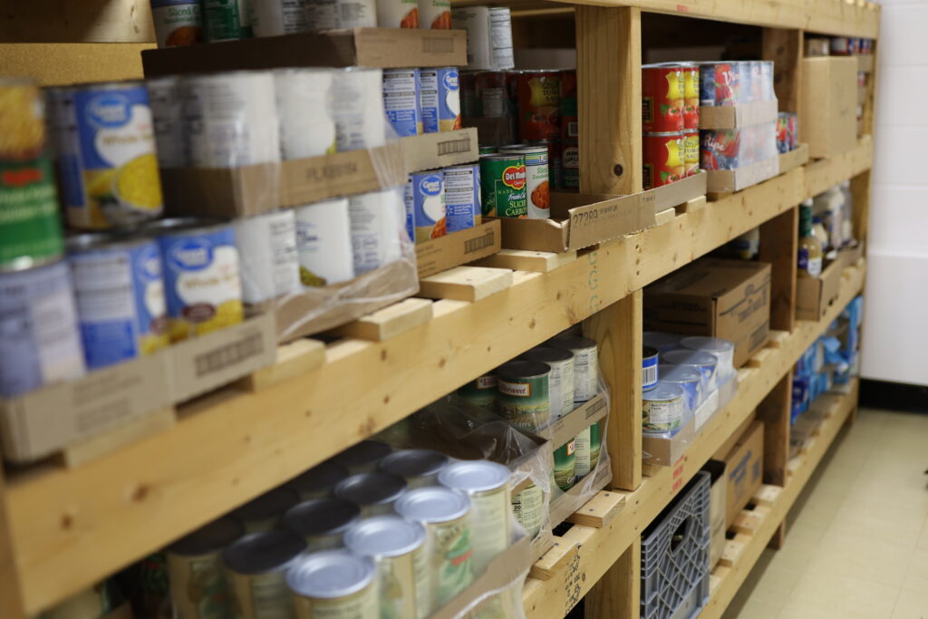 Shelves stocked with canned goods.