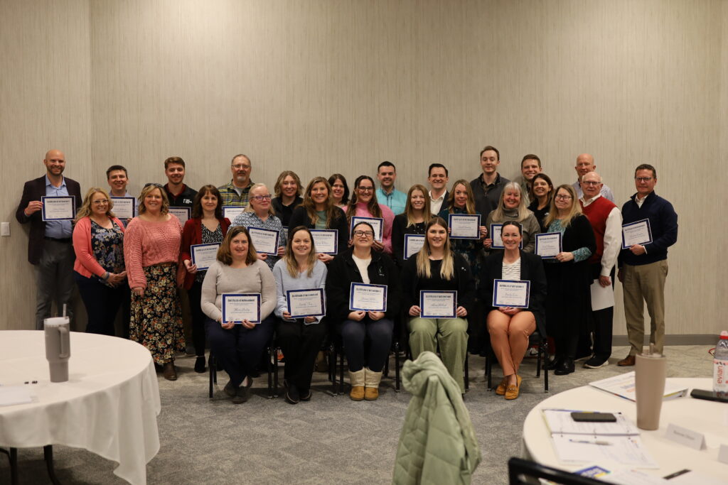 Group photo with certificates of achievement