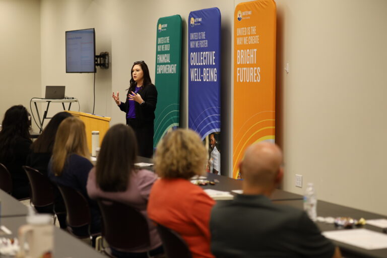 Speaker presenting to an engaged audience.