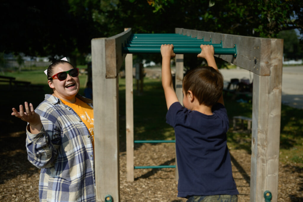 Child playing on playground equipment