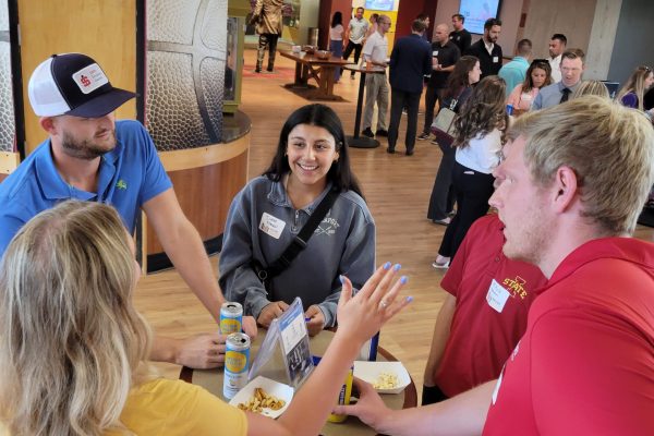 Group of people interacting indoors.