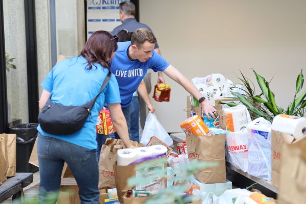 Volunteers sorting donated food items